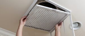 Professional technician performing residential air duct cleaning in Sarasota to improve indoor air quality and HVAC efficiency.