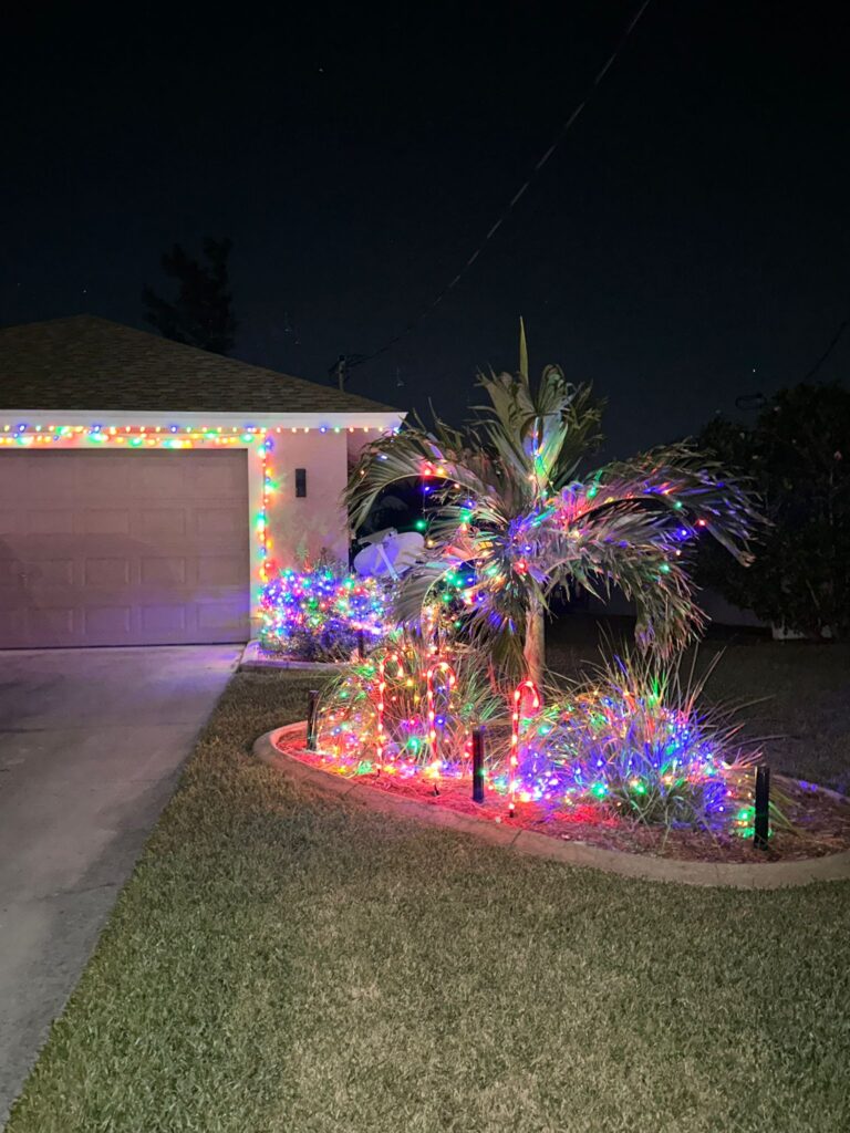 Professionally installed holiday lighting on a home in Fort Lauderdale, featuring a festive design.