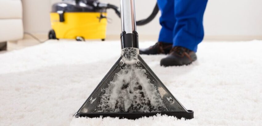 Professional carpet cleaning in Atlanta by Clean Obsession, showcasing deep-cleaning equipment removing dirt and stains from a residential carpet.