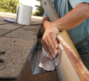 Technician cleaning a gutter on a Sarasota home.